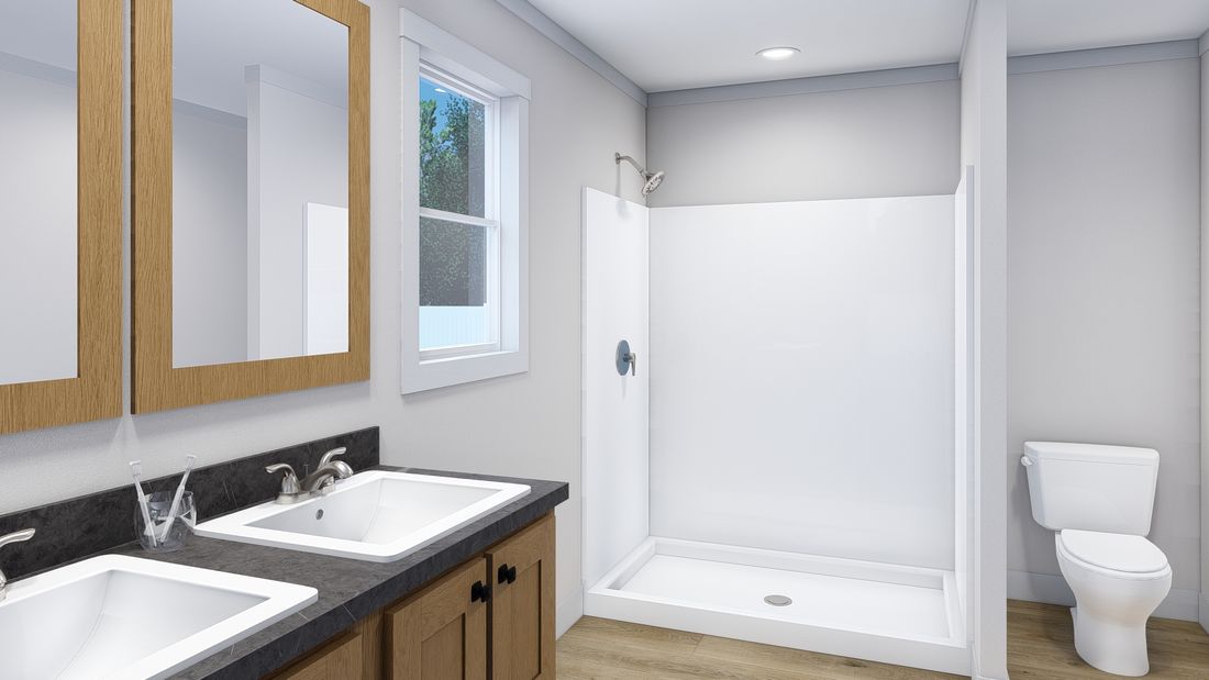The 2004 "SUPERFLY" 7628 Primary Bathroom. This Manufactured Mobile Home features 5 bedrooms and 2 baths.